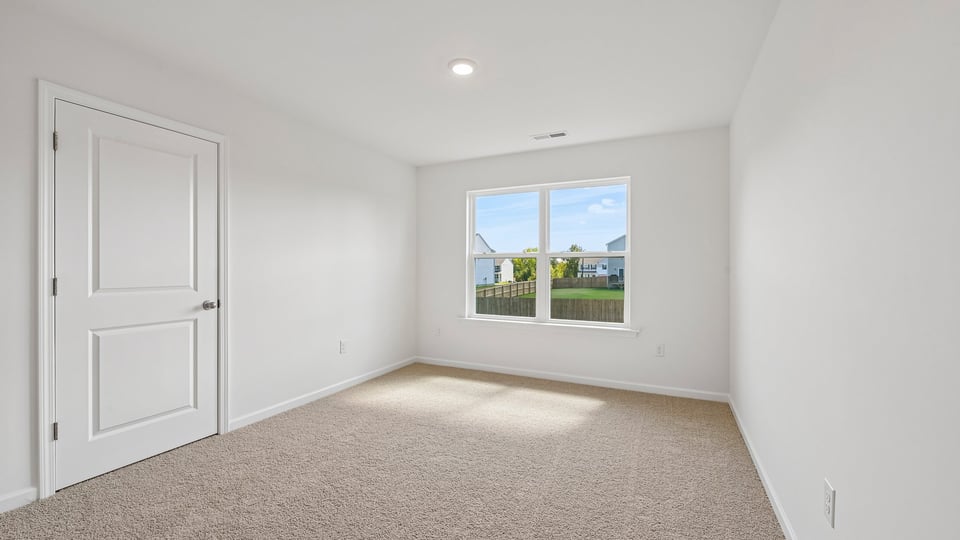 loft with carpet flooring