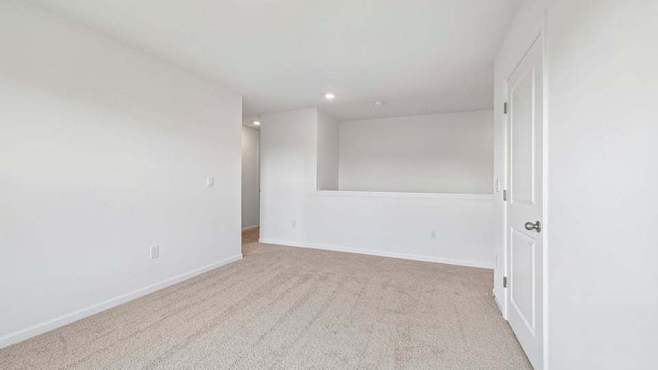 loft with carpet flooring