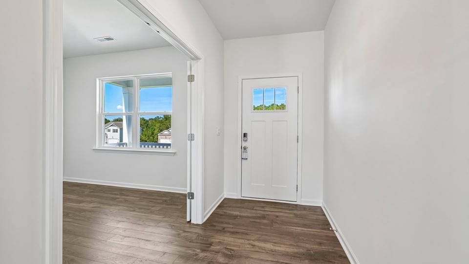 foyer entryway with revwoof dlooring