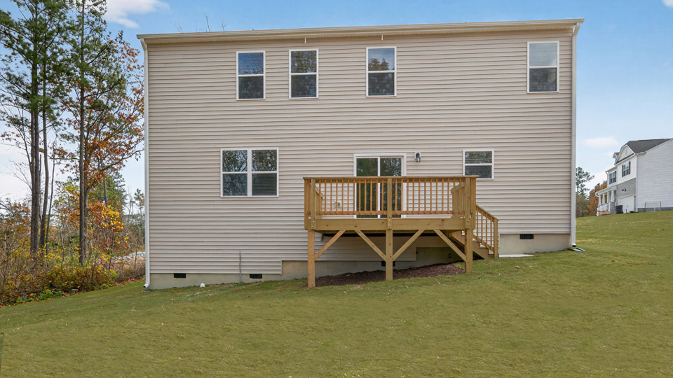back exterior columbia with deck and open yard