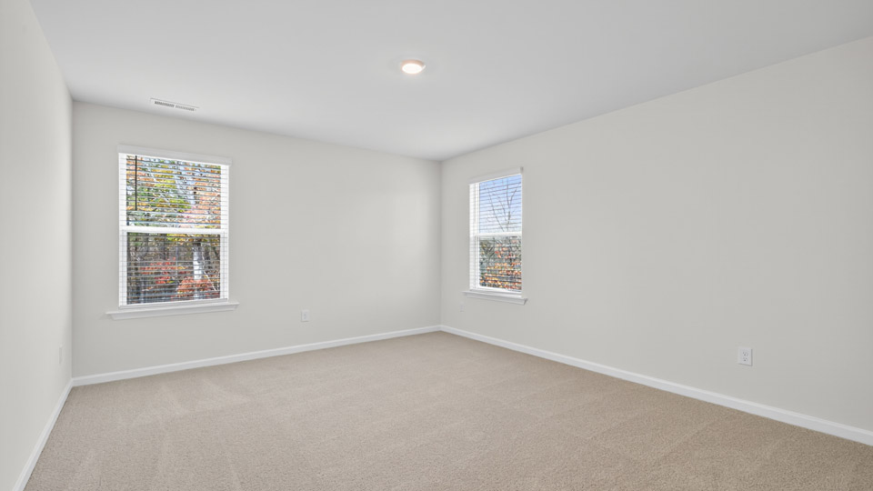 additional bedroom with window, carpeting, closet
