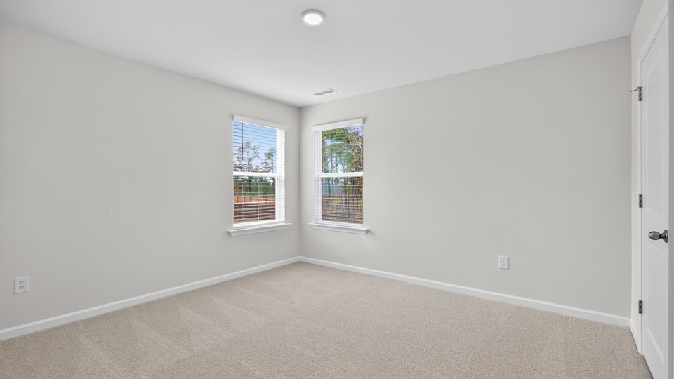 additional bedroom with window, carpeting, closet