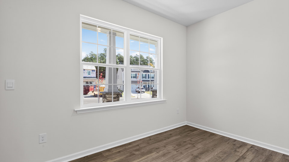 Study room with hardwood floors and big windows