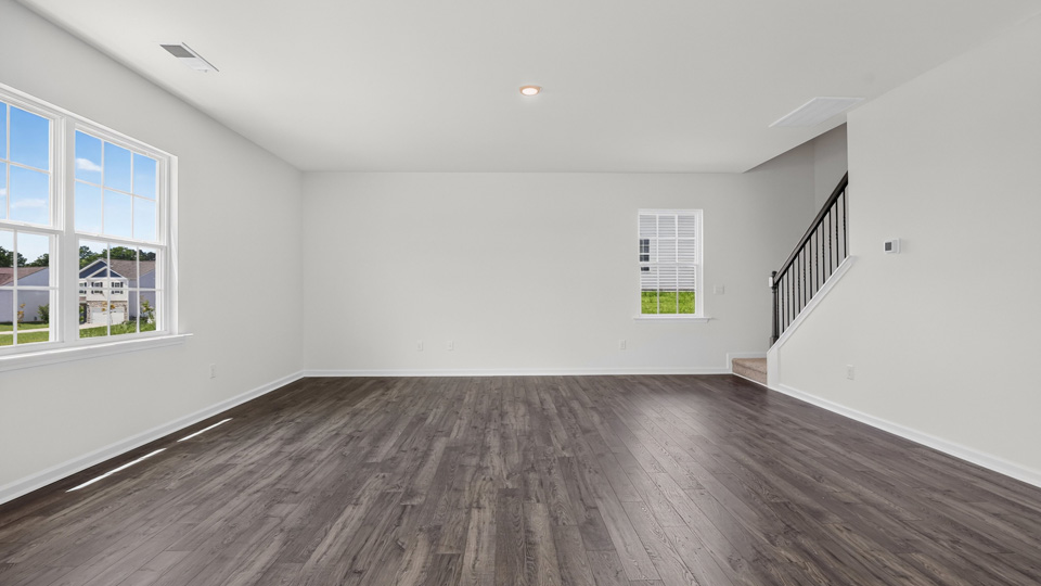 open concept living space with large windows