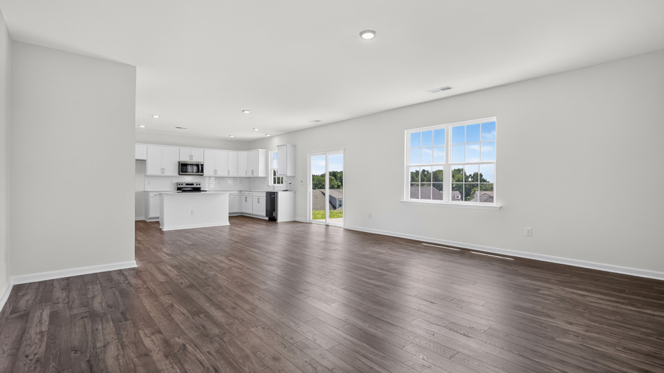open concept living space with large windows
