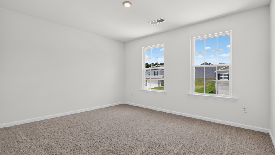 additional bedroom with window, carpeting, closet