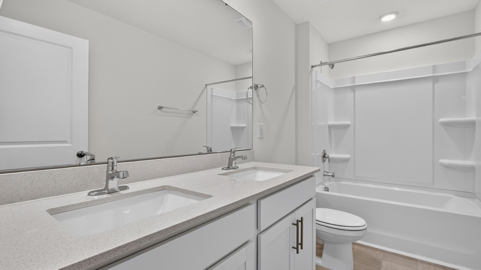 additional bathroom with double vanity sink