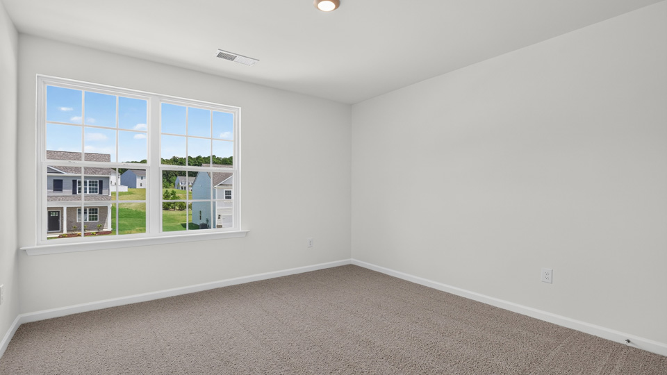 additional bedroom with window, carpeting, closet