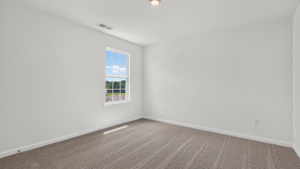 additional bedroom with window, carpeting, closet