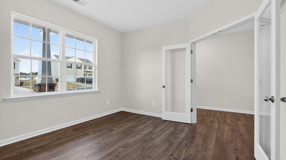 Study room with hardwood floors and big windows