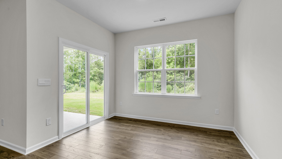 open concept dining space with door to patio