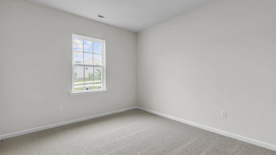 additional bedroom with window, carpeting, closet