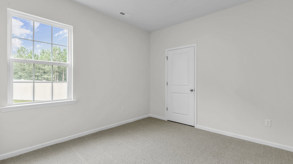 additional bedroom with window, carpeting, closet