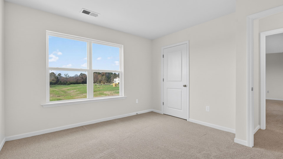 Bedroom with carpet floor and closet
