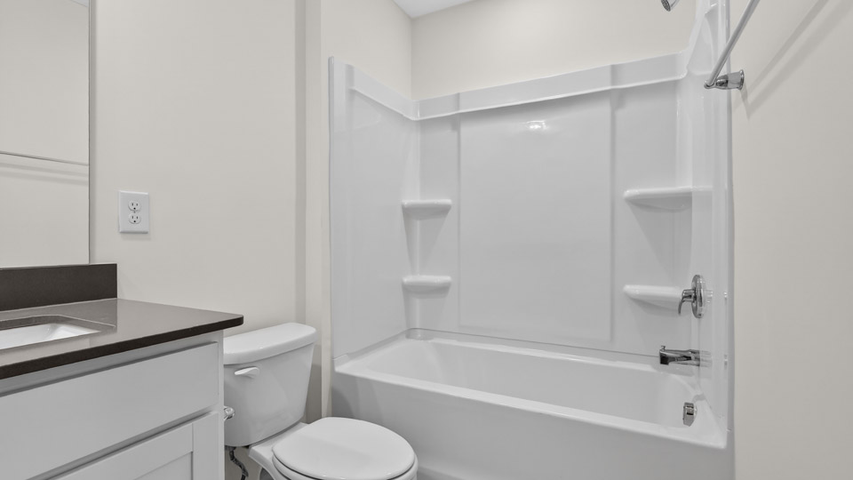 Bathroom with double sink and tub