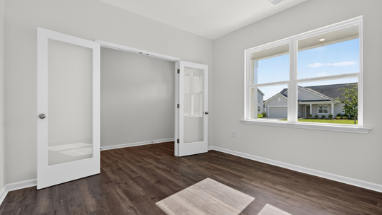 study with revwood flooring and french doors