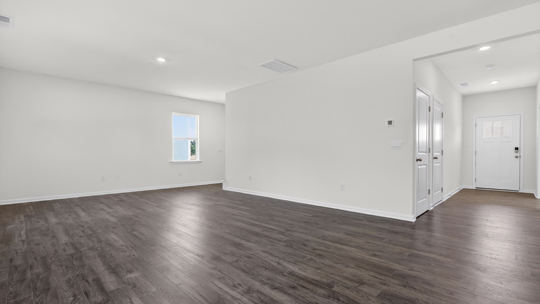 living room with revwood flooring