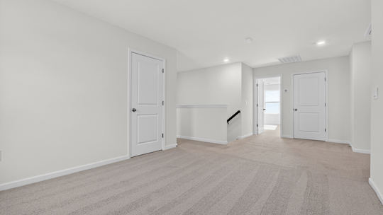 loft with carpet flooring