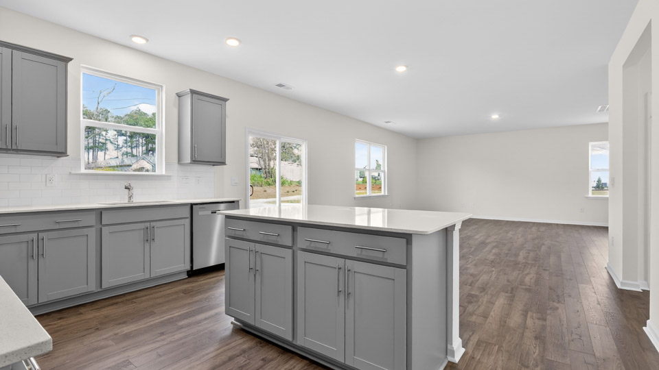 Kitchen with gray cabinets and stainless steel appliances.