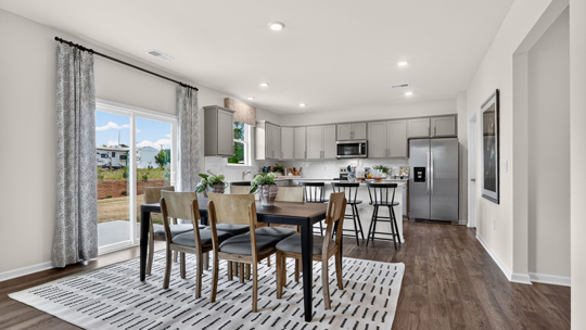 open concept kitchen and dining areas