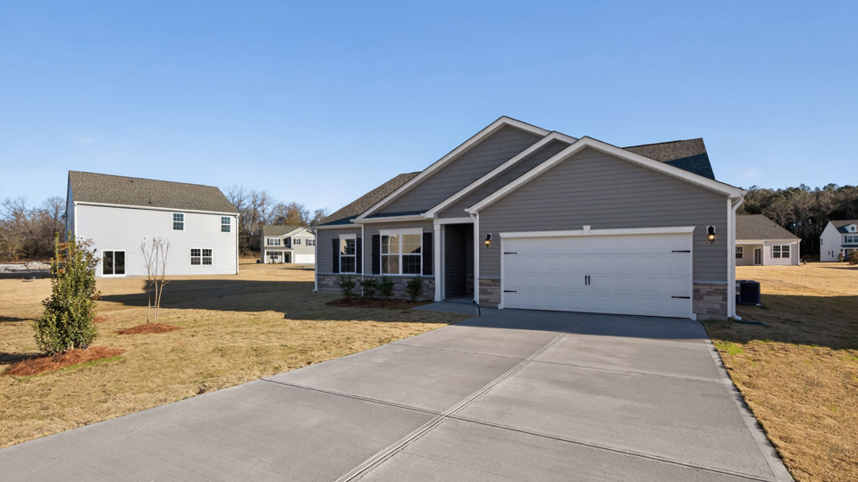 One story home with gray siding and a two-car garage.
