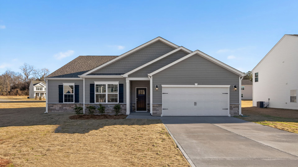 One story home with gray siding and a two-car garage.