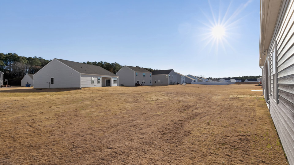 Covered back patio overlooking backyard