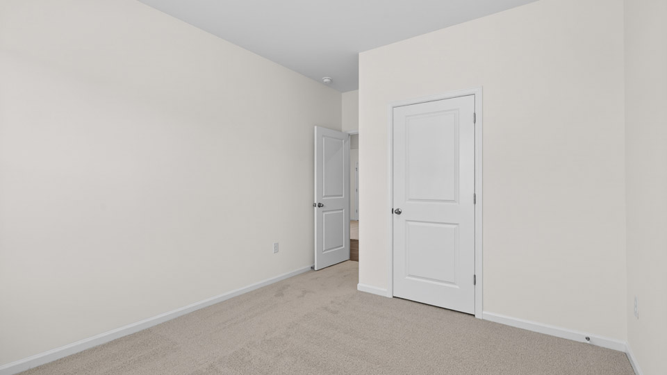 Bedroom with carpet floor and closet