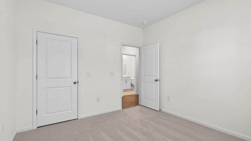 Bedroom with carpet floor and closet