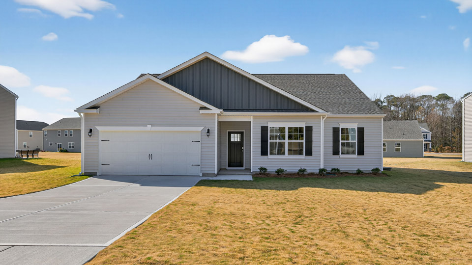 Single-story home with gray siding and a covered porch and two-car garage.