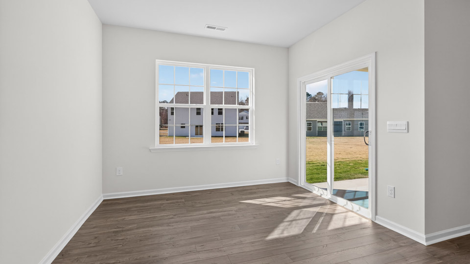 Dining room area with sliding glass door leading to back patio