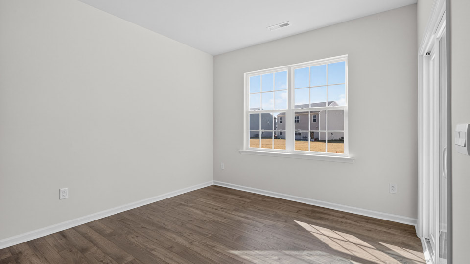Study room with hardwood floors and big windows