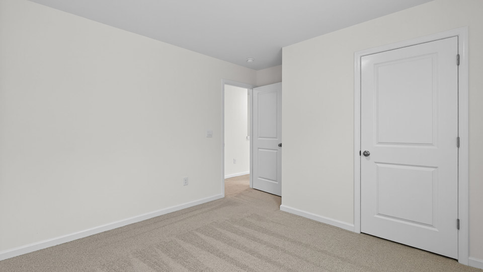 Bedroom with carpet floor and closet