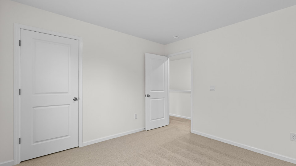 Bedroom with carpet floor and closet