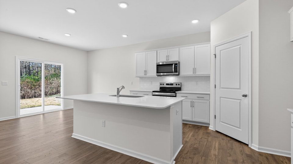 Kitchen with white cabinets and stainless steel appliances.