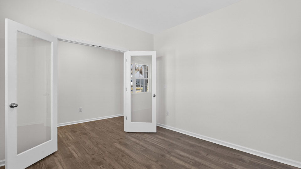 Study room with hardwood floors and big windows