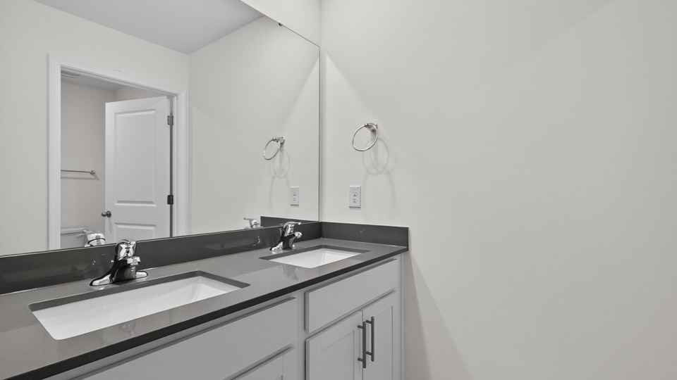 Bathroom with double sink and tub