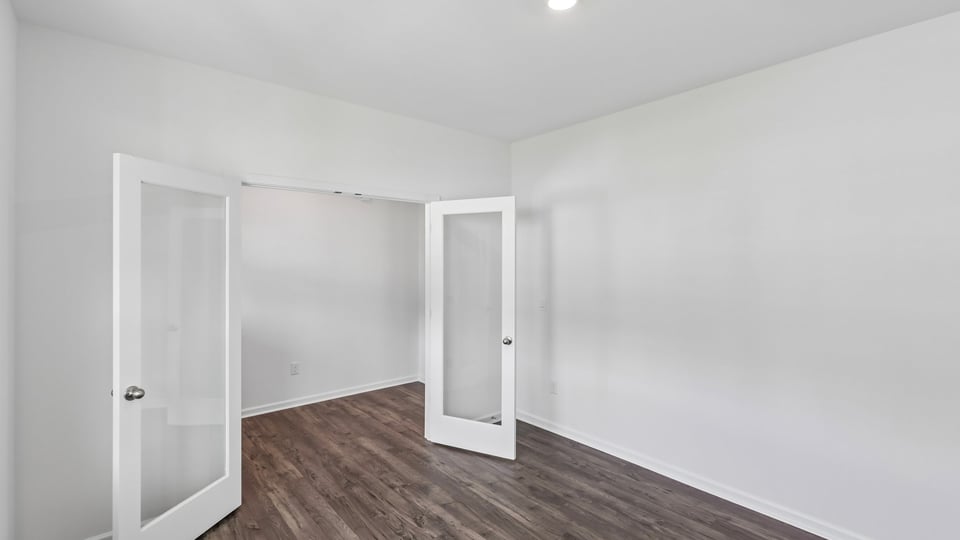 study with revwood flooring and french doors