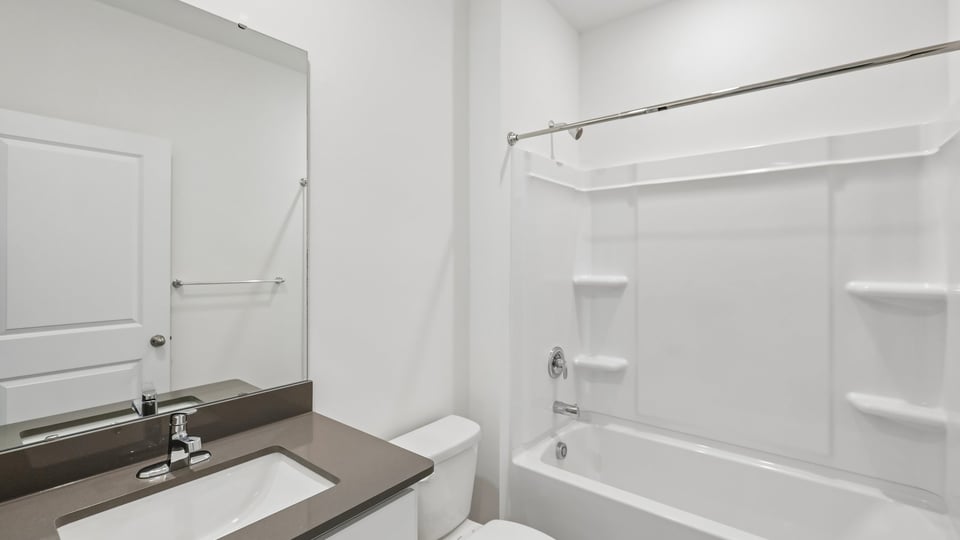 bathroom with tub shower combo