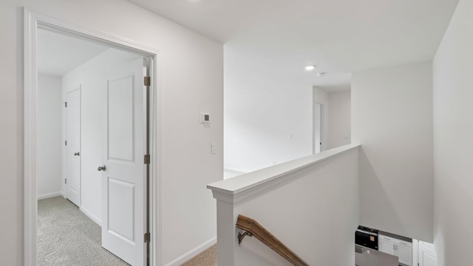top of stairs at loft with carpet flooring