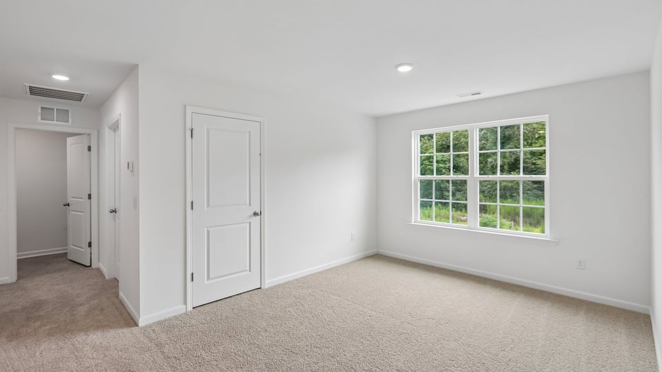 loft with carpet flooring