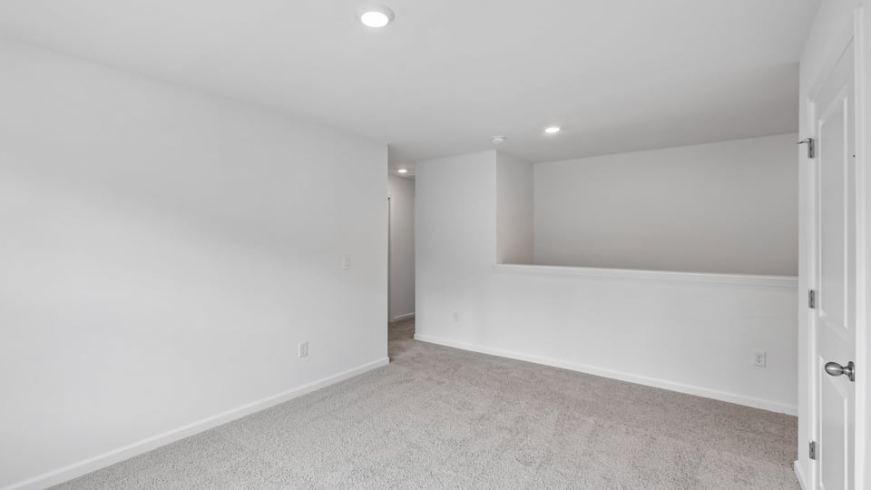 loft with carpet flooring