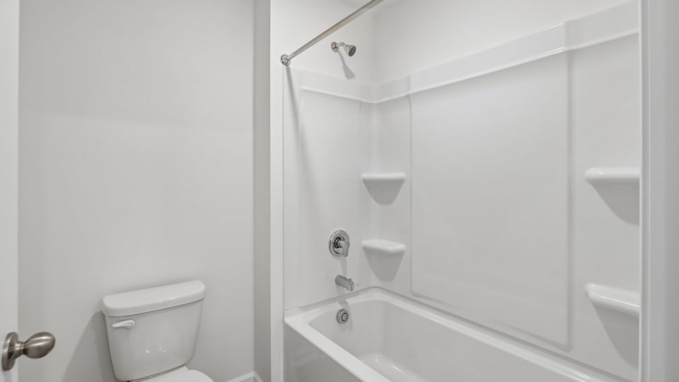 bathroom with tub shower combo