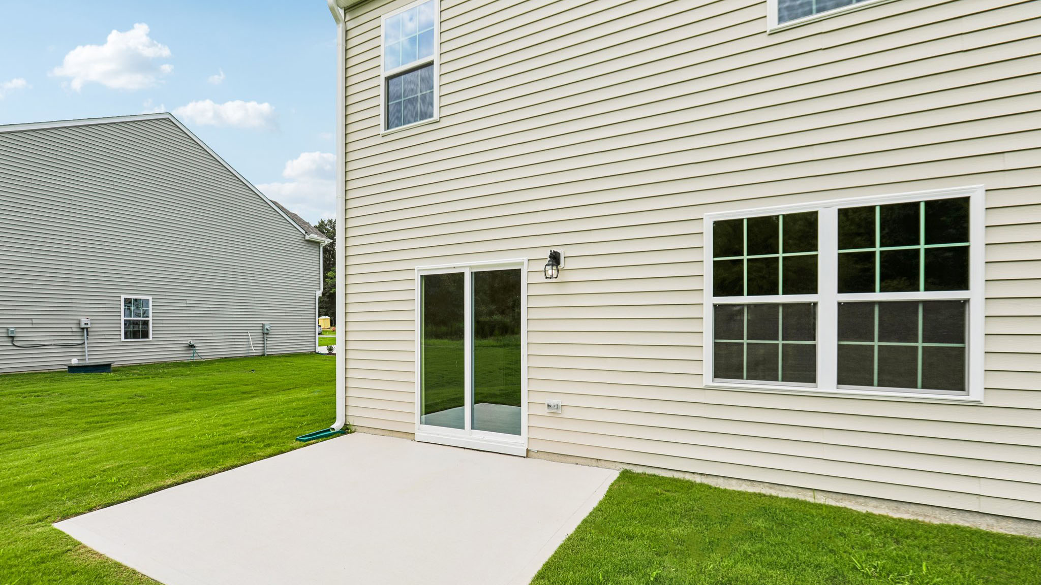back of hayden with concrete patio