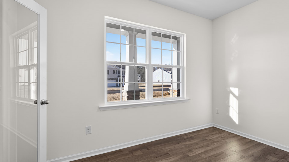 Study room with hardwood floors and big windows