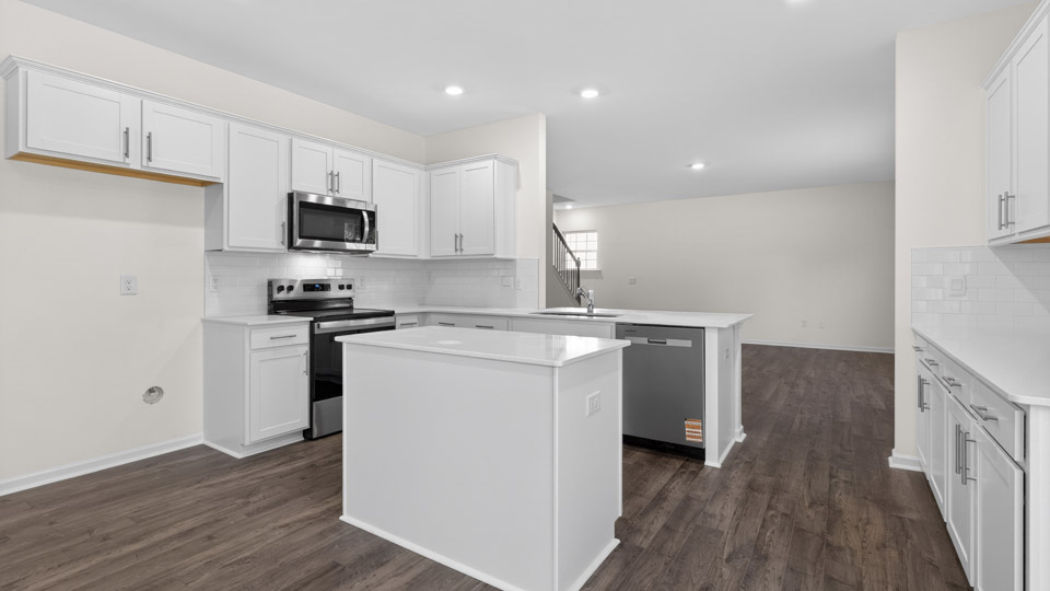Kitchen with white cabinets and stainless steel appliances.