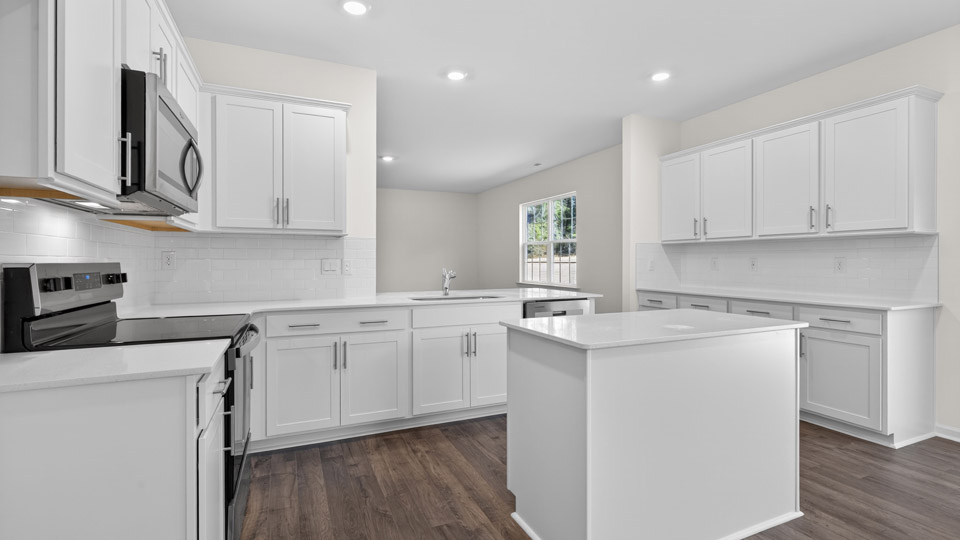 Kitchen with white cabinets and stainless steel appliances.
