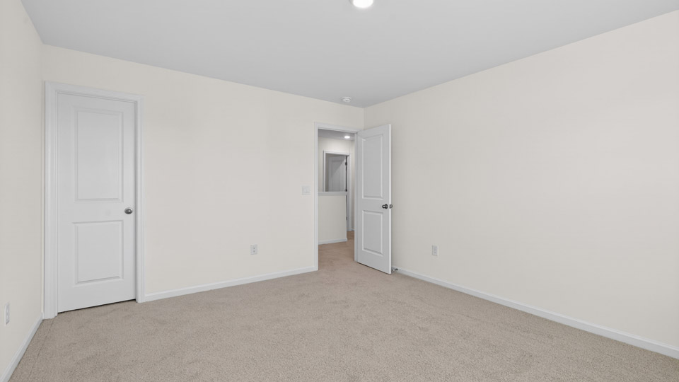 Bedroom with carpet floor and closet
