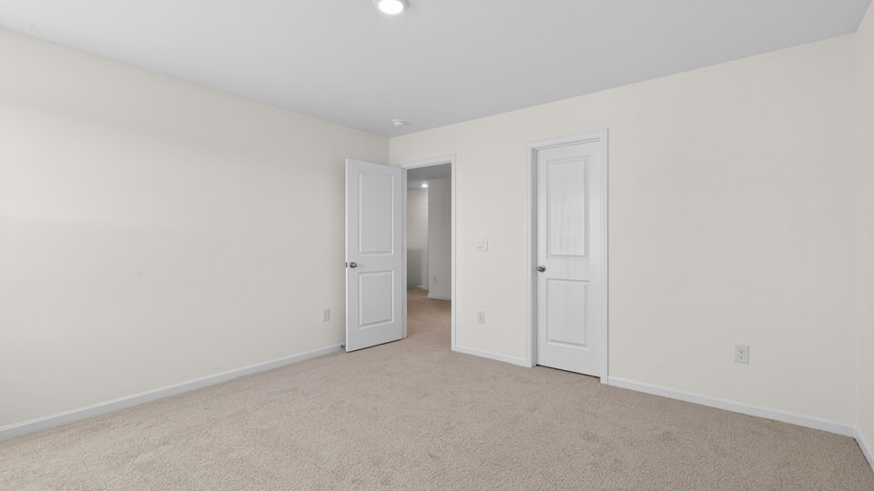 Bedroom with carpet floor and closet