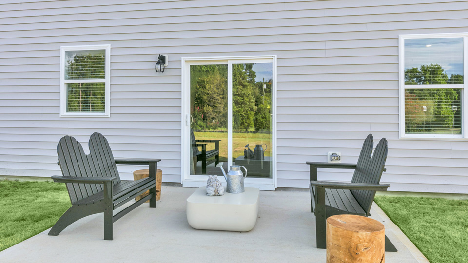 concrete patio with sliding glass doors